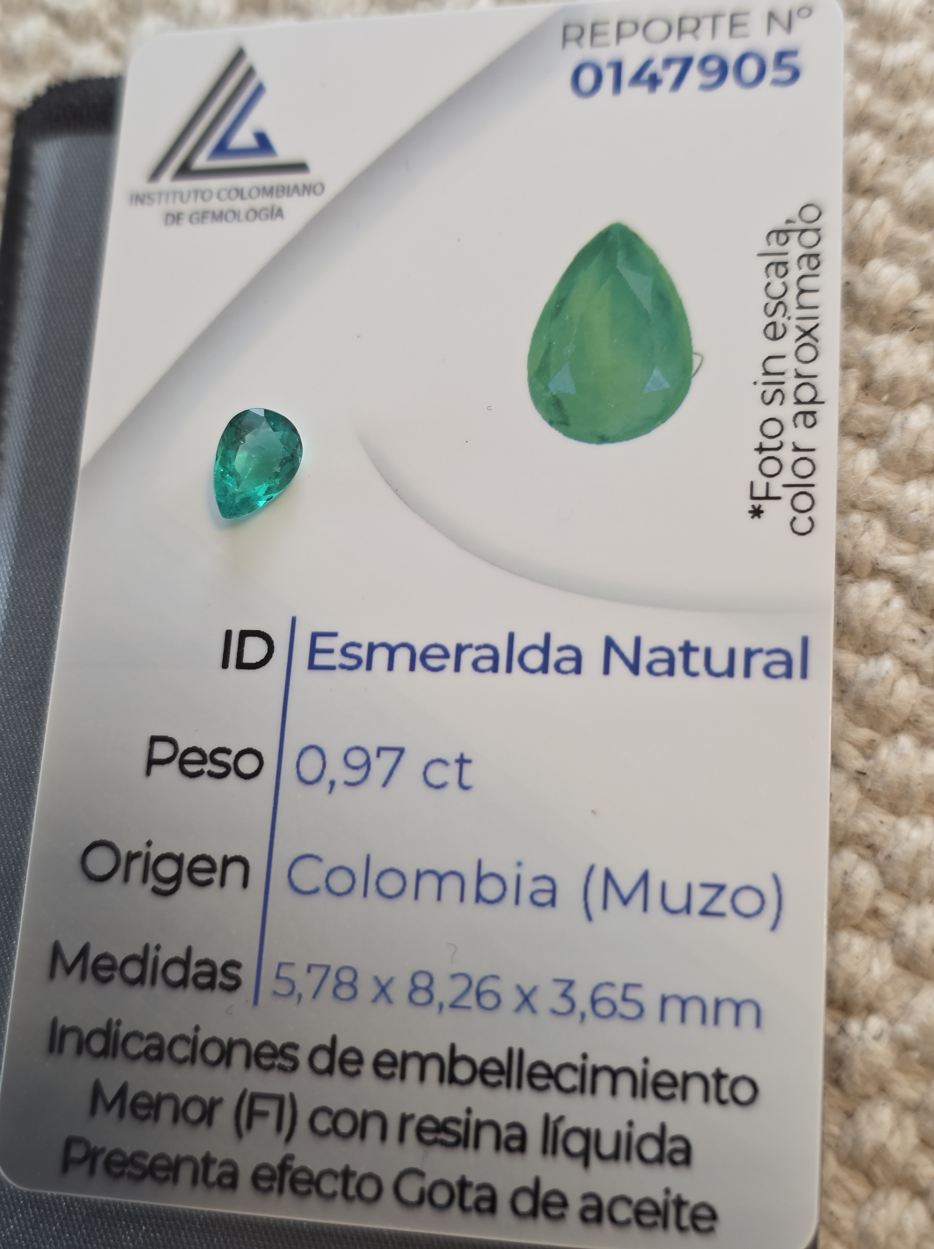 Instituto Colombiano de Gemología certification card for a 0.97 ct natural Colombian Muzo emerald
